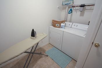 This is a photo of the laundry closet with washer and dryer in the 1040 square foot 2 bedroom Patriot at Washington Place Apartments in Washington Township, OH.